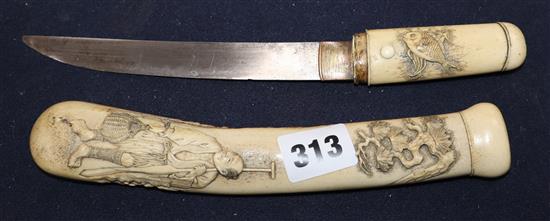 A Japanese Meiji carved staghorn dagger